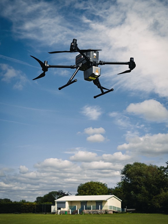 UAV X500 and Alpha Air 10 performing aerial surveying in a countryside area