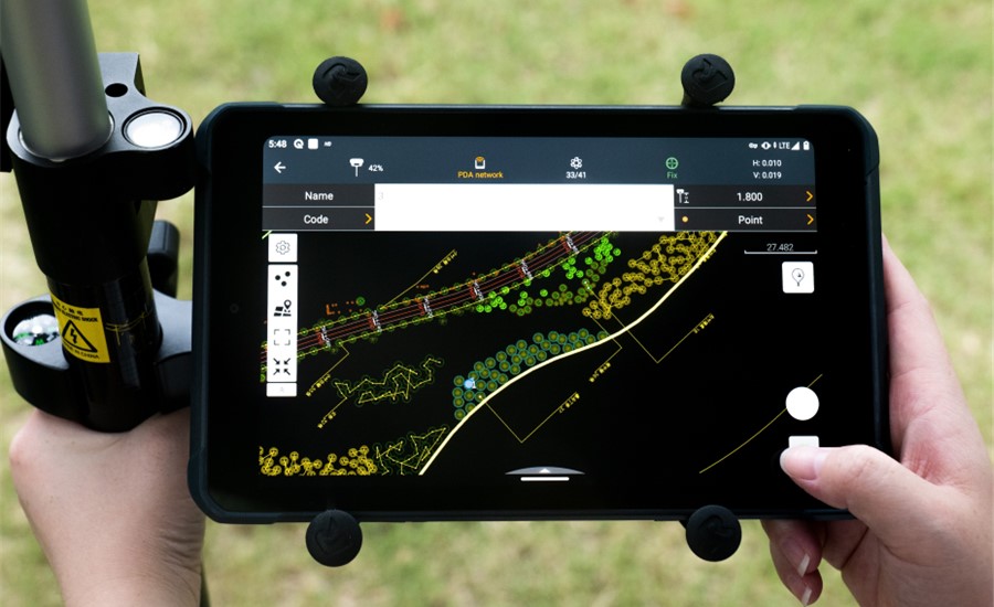 Field data collection with LandStar surveying software on a CHCNAV LT800 data controller during on-site land surveying operations.